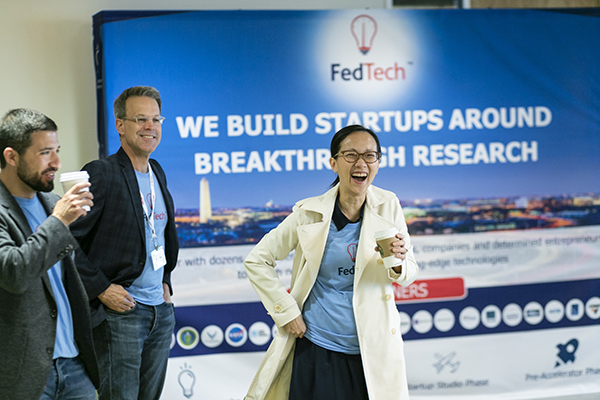Jake Kramer, managing partner at FedTech, left; Andy Lewis, FedTech guest instructor, middle; and Trang Pham, FedTech mentor, present to the group at the end of the 2021 program. Credits: FedTech