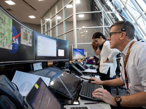 NASA personnel using software