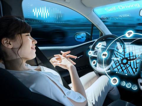 Illustrated graphic of a driver in a self-driving vehicle surrounded by a biocybernetic system