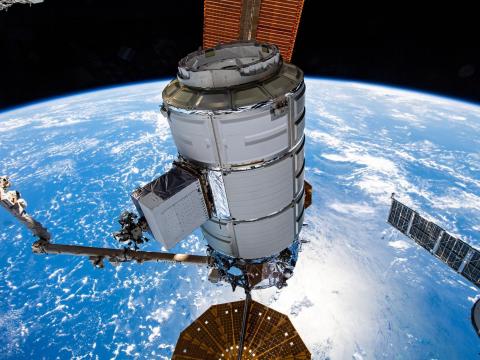 Northrop Grumman's Cygnus space freighter is pictured in the grip of the Canadarm2 robotic arm shortly after it was detached from the Unity module