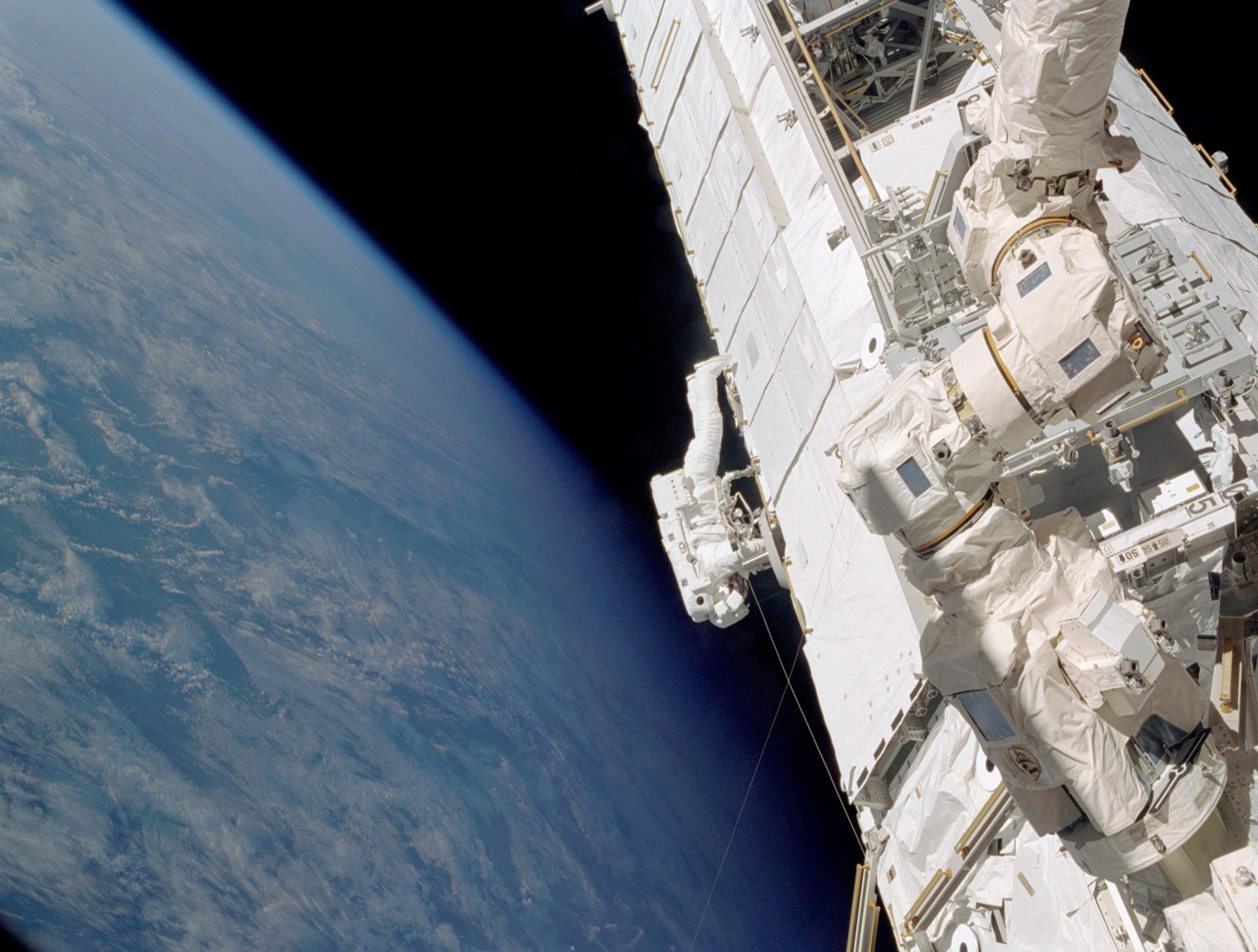 View of STS-112 Mission specialist Piers Sellers translating across the S0 truss (forward side) during the first of three Extravehicular Activities (EVAs) of the mission.