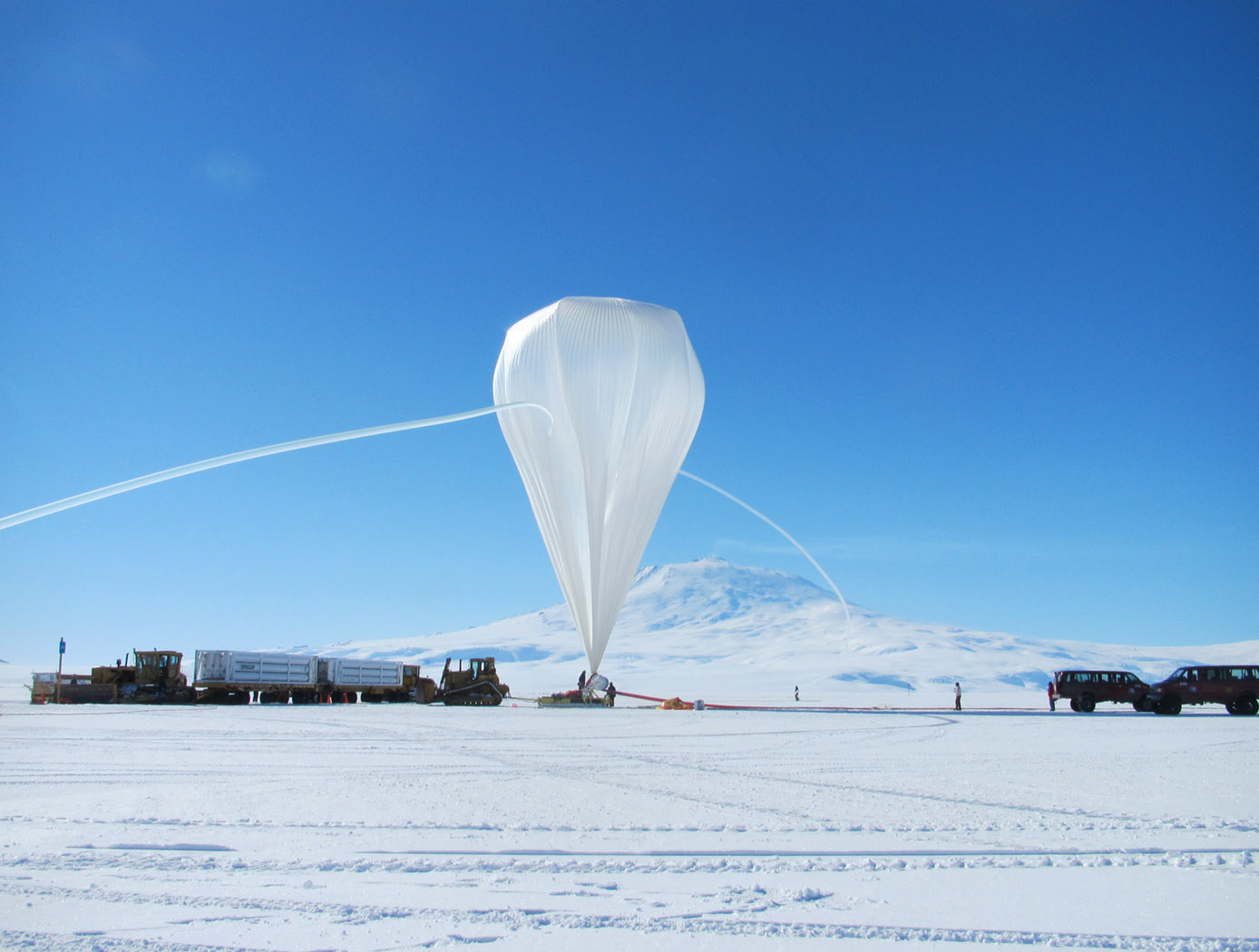 NASA image captured December 25, 2011. A NASA scientific balloon awaits launch in McMurdo, Antarctica. The balloon, carrying Indiana University's Cosmic Ray Electron Synchrotron Telescope (CREST), was launched on December 25. After a circum-navigational flight around the South Pole, the payload landed on January 5. The CREST payload is one of two scheduled as part of this seasons' annual NASA Antarctic balloon Campaign which is conducted in cooperation with the National Science Foundation's Office of Polar Programs. The campaign's second payload is the University of Arizona's Stratospheric Terahertz Observatory (STO). You can follow the flights at the Columbia Scientific Balloon Facility's web site at www.csbf.nasa.gov/antarctica/ice.htm