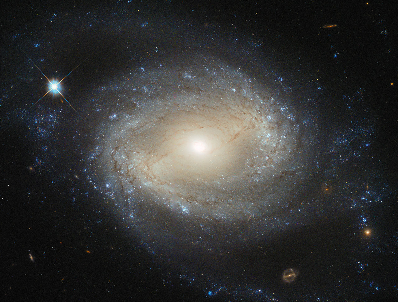 Hubble Sees Elegant Spiral Hiding a Hungry Monster; Image credit: ESA/Hubble & NASA
