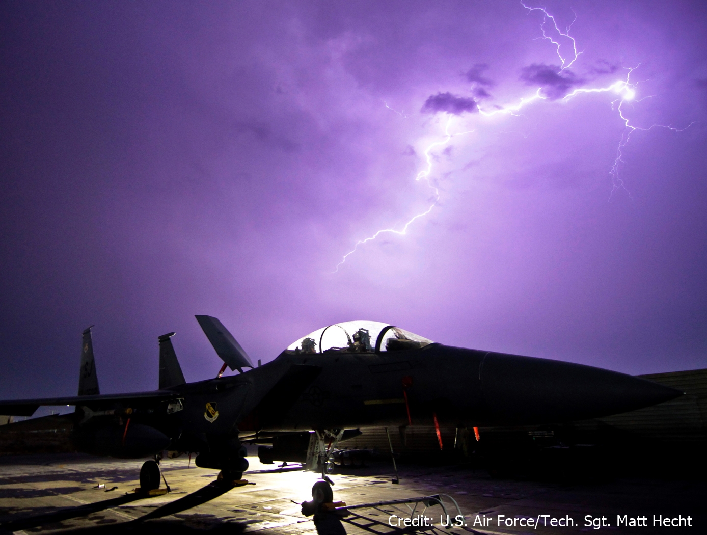 aircraft in front of lightning storm