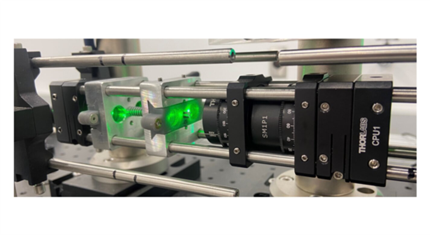 Novel two-point optical system installed in a larger experimental setup for Focused Laser Differential Interferometry testing. The green laser light is seen passing through the two sets of wedged windows.