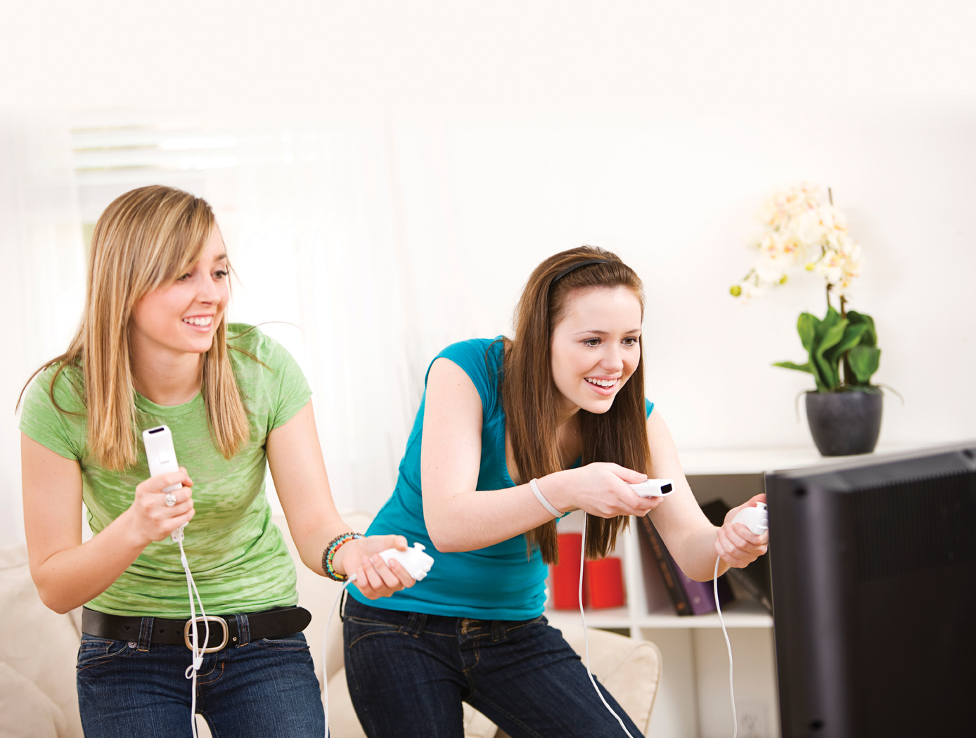 Two young women playing video games