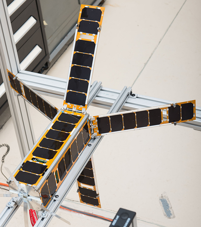 Glenn's SMA release and hinging mechanisms were successfully used on NASA's ALBus CubeSat (above) to deploy solar antennas