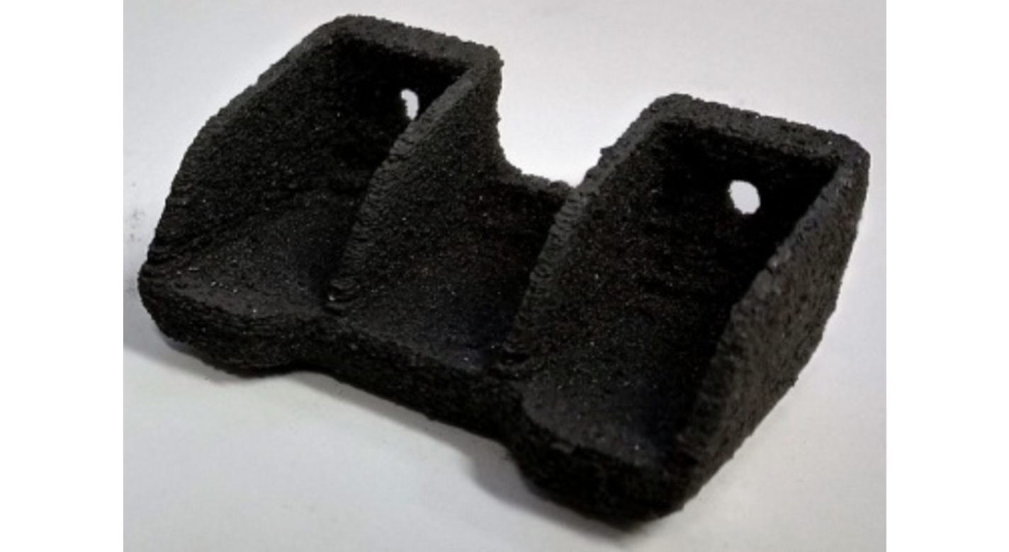 NASA's SLS manufactured carbon-filled thermoset polyimide composite shown above is not fully cured.  The "green" part is subjected to multi-step post-cure process that gradually heats the composite from room temperature to slightly below its softening temperature to complete the final curing.